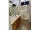 Bathroom featuring double sinks and a shower at 6045 Riverwalk Falls St # 102, North Las Vegas, NV 89031