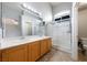 Bathroom featuring a large vanity and a glass-enclosed shower at 6045 Riverwalk Falls St # 102, North Las Vegas, NV 89031