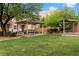 Inviting community park featuring picnic tables and lush green lawns, perfect for outdoor gatherings at 6045 Riverwalk Falls St # 102, North Las Vegas, NV 89031