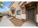 Inviting home entrance showcasing neutral tones, manicured landscaping, and a welcoming front door at 6045 Riverwalk Falls St # 102, North Las Vegas, NV 89031