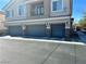 Inviting home featuring a three-car garage and a charming second-story balcony at 6045 Riverwalk Falls St # 102, North Las Vegas, NV 89031