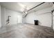 Spacious garage featuring concrete floors, white walls, and ample room for parking and storage at 6045 Riverwalk Falls St # 102, North Las Vegas, NV 89031