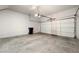 Clean, well-lit garage with white walls and concrete floor at 6045 Riverwalk Falls St # 102, North Las Vegas, NV 89031
