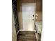 Functional laundry room with modern washer and dryer, ample space, and wood-look flooring at 6045 Riverwalk Falls St # 102, North Las Vegas, NV 89031
