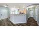 Inviting living room features modern flooring and an open layout to the kitchen area at 6045 Riverwalk Falls St # 102, North Las Vegas, NV 89031