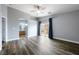 Spacious main bedroom with wood floors and large windowed sliding door at 6045 Riverwalk Falls St # 102, North Las Vegas, NV 89031