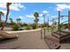 Community playground featuring slides, monkey bars, and soft ground cover for safe outdoor fun at 6045 Riverwalk Falls St # 102, North Las Vegas, NV 89031