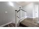 Modern staircase with sleek railings and wood-look flooring at 6045 Riverwalk Falls St # 102, North Las Vegas, NV 89031