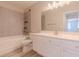 Bright bathroom features a tub and shower combo, white vanity and modern fixtures at 6361 W Viking Rd, Las Vegas, NV 89103