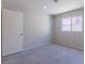 Bedroom featuring carpeted floors, a window, and neutral colored walls at 6361 W Viking Rd, Las Vegas, NV 89103