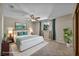 Comfortable bedroom with plush carpet, a ceiling fan, and ample natural light creating a relaxing retreat at 6361 W Viking Rd, Las Vegas, NV 89103