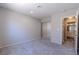 Bedroom features carpeted floors, neutral colored walls, and a closet with mirror doors at 6361 W Viking Rd, Las Vegas, NV 89103
