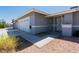 Charming single-story home featuring a well-manicured lawn, secure gate and an attached garage at 6361 W Viking Rd, Las Vegas, NV 89103