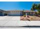 Charming single-story home with well-maintained landscaping and a two-car garage at 6361 W Viking Rd, Las Vegas, NV 89103