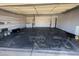 Spacious garage with shelving, washer and dryer hookups, with concrete flooring at 6361 W Viking Rd, Las Vegas, NV 89103