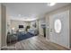 Bright living room featuring laminate flooring, recessed lighting, and ample seating for a welcoming atmosphere at 6361 W Viking Rd, Las Vegas, NV 89103