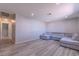 Bright and open living room with laminate flooring and recessed lighting at 6361 W Viking Rd, Las Vegas, NV 89103