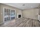 Stylish living room with a cozy fireplace and seamless access to the backyard pool area through sliding glass doors at 6361 W Viking Rd, Las Vegas, NV 89103