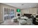 Stylish living room with a cozy fireplace and seamless access to the backyard pool area through sliding glass doors at 6361 W Viking Rd, Las Vegas, NV 89103