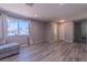 Bright living room showcasing modern floors, and a large window at 6361 W Viking Rd, Las Vegas, NV 89103