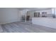 Open concept living space featuring modern floors and an adjacent kitchen and dining area at 6361 W Viking Rd, Las Vegas, NV 89103