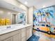 Bathroom features a double sink vanity and a vibrant shower curtain at 8701 Giant Causeway Ave, Las Vegas, NV 89148