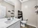 Bathroom offers a single sink vanity and decorative shelving at 8701 Giant Causeway Ave, Las Vegas, NV 89148
