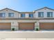 Townhome garages showcasing a modern and simple design at 8701 Giant Causeway Ave, Las Vegas, NV 89148