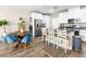 Modern kitchen with stainless steel appliances, white cabinetry, and breakfast bar seating at 8701 Giant Causeway Ave, Las Vegas, NV 89148
