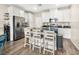 Modern kitchen featuring stainless steel appliances, ample counter space, and seating at 8701 Giant Causeway Ave, Las Vegas, NV 89148