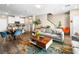 Spacious living room with wood floors, comfortable seating, and access to the kitchen at 8701 Giant Causeway Ave, Las Vegas, NV 89148