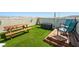 Private rooftop deck with artificial turf, picnic table, and seating at 8701 Giant Causeway Ave, Las Vegas, NV 89148