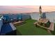 Cozy rooftop deck for relaxation with lounge chairs, a picnic table, and ambient lighting at 8701 Giant Causeway Ave, Las Vegas, NV 89148