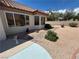 The backyard has gravel throughout and brick walkways at 9048 Litchfield Ave, Las Vegas, NV 89134