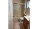 Bathroom features a shower with glass doors, tiled floors, and a modern sink and toilet at 9048 Litchfield Ave, Las Vegas, NV 89134