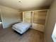 This bedroom features a pull down Murphy bed, built in book shelves, and tile floors at 9048 Litchfield Ave, Las Vegas, NV 89134