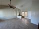 Spacious living room featuring vaulted ceiling and neutral-toned flooring at 9048 Litchfield Ave, Las Vegas, NV 89134