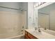 Bathroom featuring a shower-tub combo with tile surround and a single sink vanity with chrome fixtures at 9303 Gilcrease Ave # 2178, Las Vegas, NV 89149