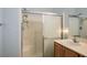 Bathroom with shower featuring a glass door, a sink, and modern fixtures at 9303 Gilcrease Ave # 2178, Las Vegas, NV 89149