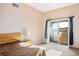 Bedroom features a glass sliding door to a patio, neutral walls, and carpet at 9303 Gilcrease Ave # 2178, Las Vegas, NV 89149