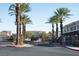 Gated community entrance with palm trees and well-maintained landscaping at 9303 Gilcrease Ave # 2178, Las Vegas, NV 89149