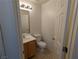 Compact half bathroom with a vanity and mirror, simple and functional at 10673 Alondra Peak St, Las Vegas, NV 89183