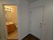 Compact half bathroom with a vanity and mirror, visible through the doorway at 10673 Alondra Peak St, Las Vegas, NV 89183