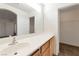Bathroom features a long vanity with sink, mirror, and walk-in closet at 10673 Alondra Peak St, Las Vegas, NV 89183