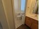 Compact bathroom featuring tile flooring, a sink vanity, and toilet at 10673 Alondra Peak St, Las Vegas, NV 89183