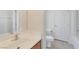 Bathroom features a single sink vanity, tile flooring, and a toilet for convenience at 10673 Alondra Peak St, Las Vegas, NV 89183