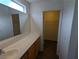 Bright bathroom with a large mirror and access to a spacious walk-in closet at 10673 Alondra Peak St, Las Vegas, NV 89183