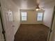Neutral bedroom featuring two windows for natural light and a ceiling fan at 10673 Alondra Peak St, Las Vegas, NV 89183
