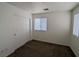 A carpeted bedroom with a closet and natural light from windows at 10673 Alondra Peak St, Las Vegas, NV 89183