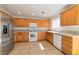 Bright kitchen with stainless steel refrigerator and plenty of cabinet space at 10673 Alondra Peak St, Las Vegas, NV 89183